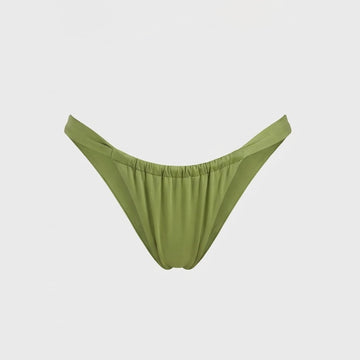 Luxury green bikini bottoms in Kiwi featuring a cheeky cut and signature shiny fabric 