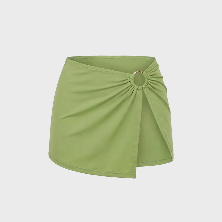 Luxury kiwi green bikini skirt featuring a signature gold ring detail and softly gathered front in vibrant green.