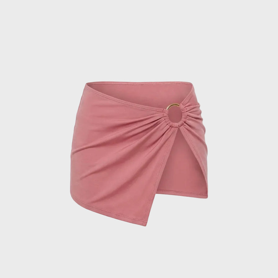 Luxury pink bikini skirt in Rosé featuring a signature gold ring detail and softly gathered front.